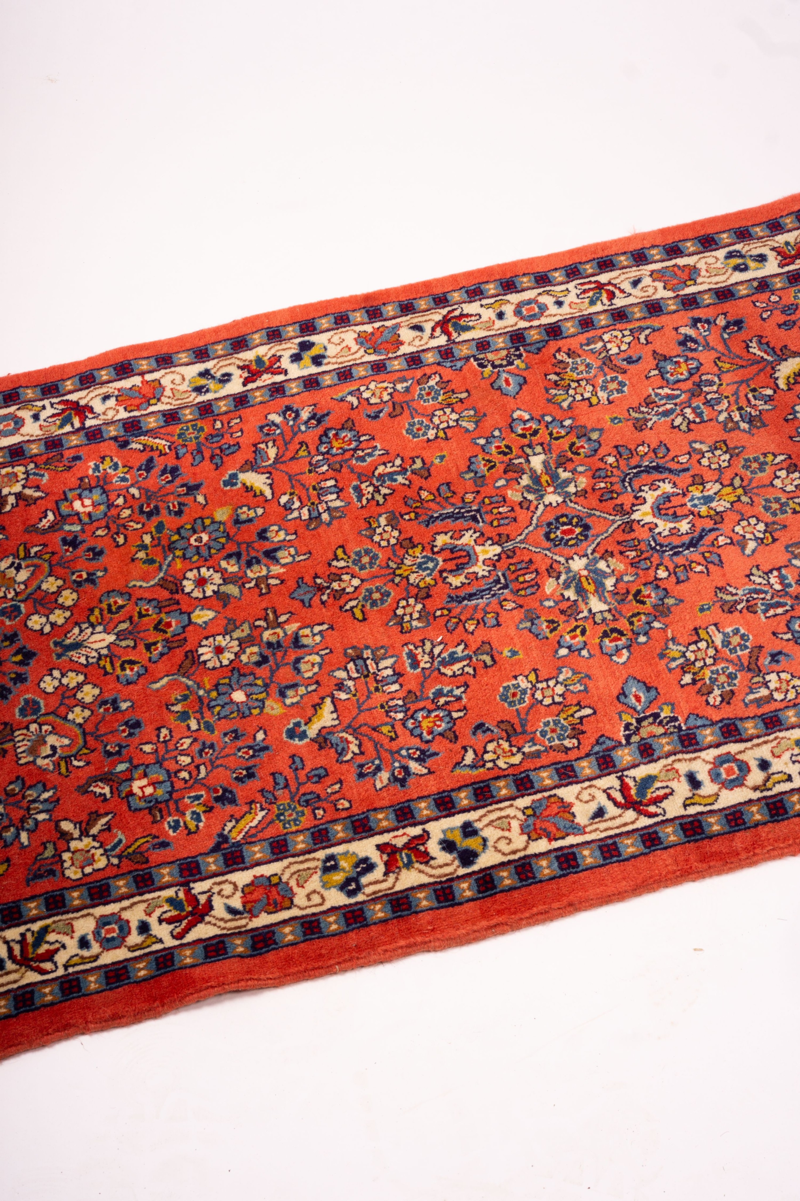 A Persian red ground runner, 202 x 83cm